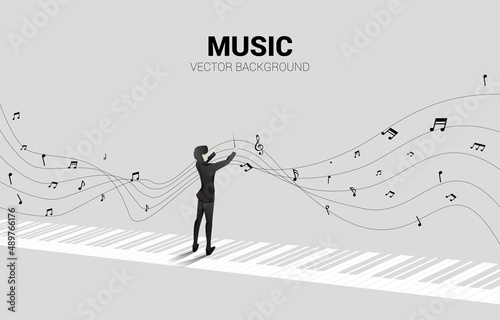 Leinwand Poster Vector silhouette of conductor standing with piano key with flying music note
