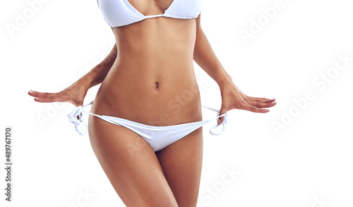 Bikini season is here. Cropped studio shot of a woman in a bikini isolated on white. photo
