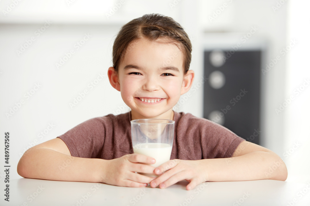 Healthy bones, happy kids. Portrait of a cute little girl enjoying a glass of milk. Healthy bones, happy kids. Portrait of a cute little girl enjoying a glass of milk.