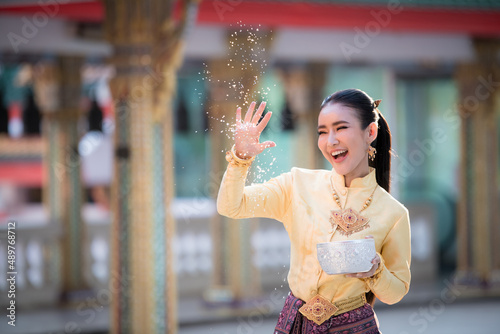 Portrait cheerful young asian woman with Songkran