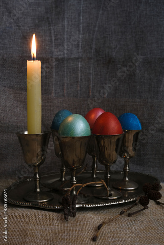 easter eggs in vintage dishes with a candle photo