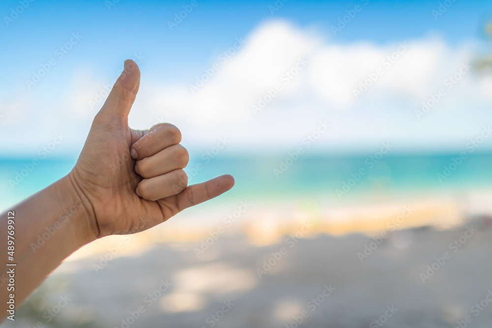 shaka, hand loose hand sign on Hawaii beach background shaka, hand loose hand sign on Hawaii beach background