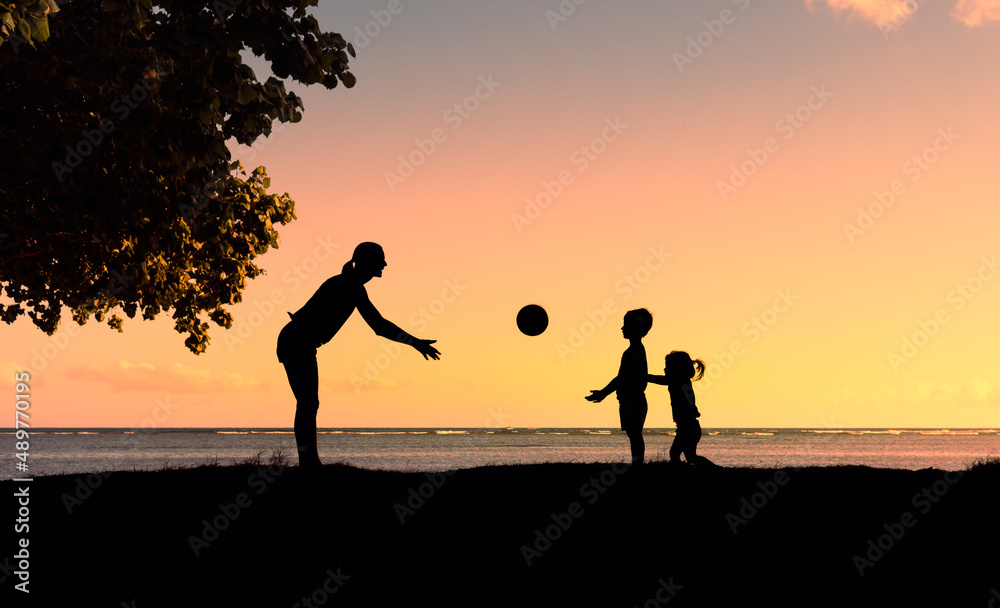 Mother woman playing game sport with little children. Family fun outdoor activity concept