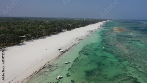 boats jachts on water sea Drone view Coastline Diani beach landscape Kenyan African Sea  aerial 4k waves blue indan ocean tropical mombasa turquoise white sand East Africa palms paradise wit coral photo