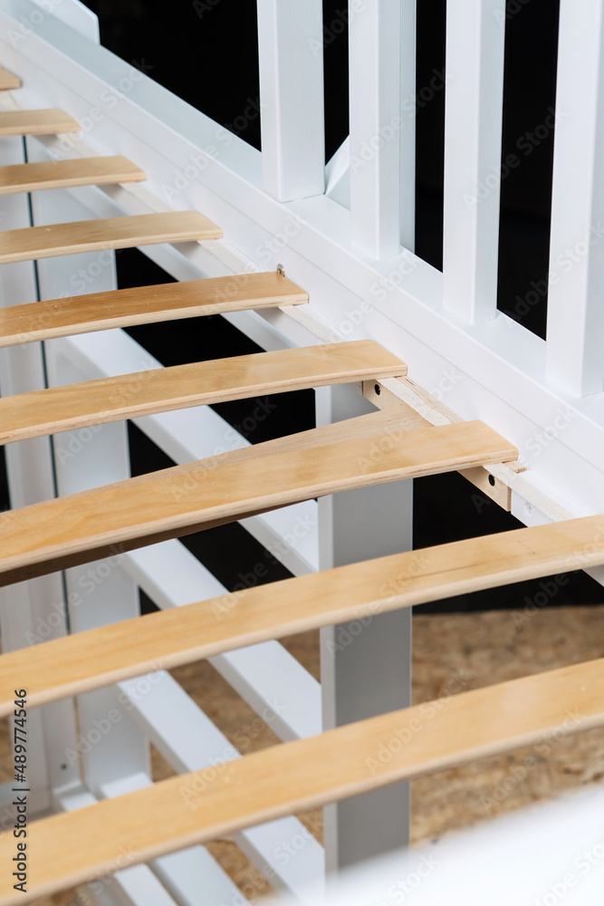 Close-up wooden elements of an orthopedic base of a bed. Interior structure of furniture. Close-up wooden elements of an orthopedic base of a bed. Interior structure of furniture.