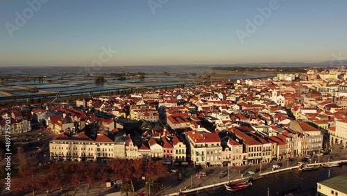 Aerial view of Aveiro city on the west coast of Portugal set along a lagoon called Ria de Aveiro. It's distinguished by its canals navigated by colorful boats