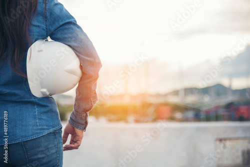 Фотография Woman construction engineer wear safety white hard hat at construction site industry worker