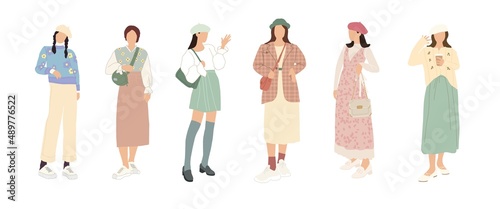 A set of stylish people in fashionable casual outfits with accessories and bags. Young modern women in fashionable spring and summer clothes. Color flat illustration isolated on a white background