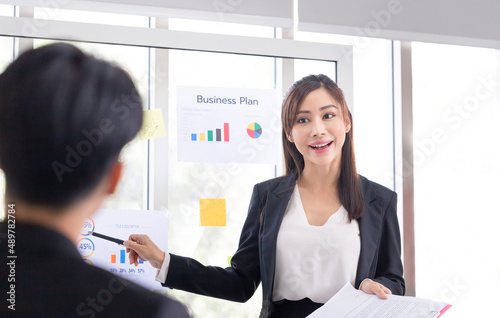 Business woman making a presentation in front of board, Young business people meeting and share idea at office, Brainstorming concepts