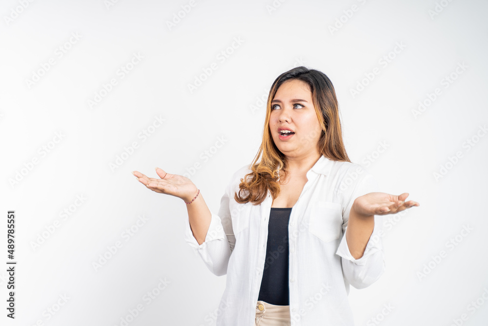asian woman feeling shocked and suprised over isolated background asian woman feeling shocked and suprised over isolated background