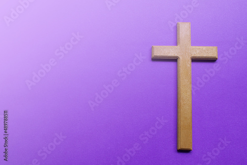 Palm leaves on purple background. Holy week and Lent season concept.