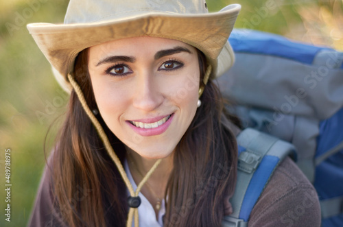 Enjoying the outdoors. A gorgeous young hiker looking at the camera. © Antonio D/peopleimages.com