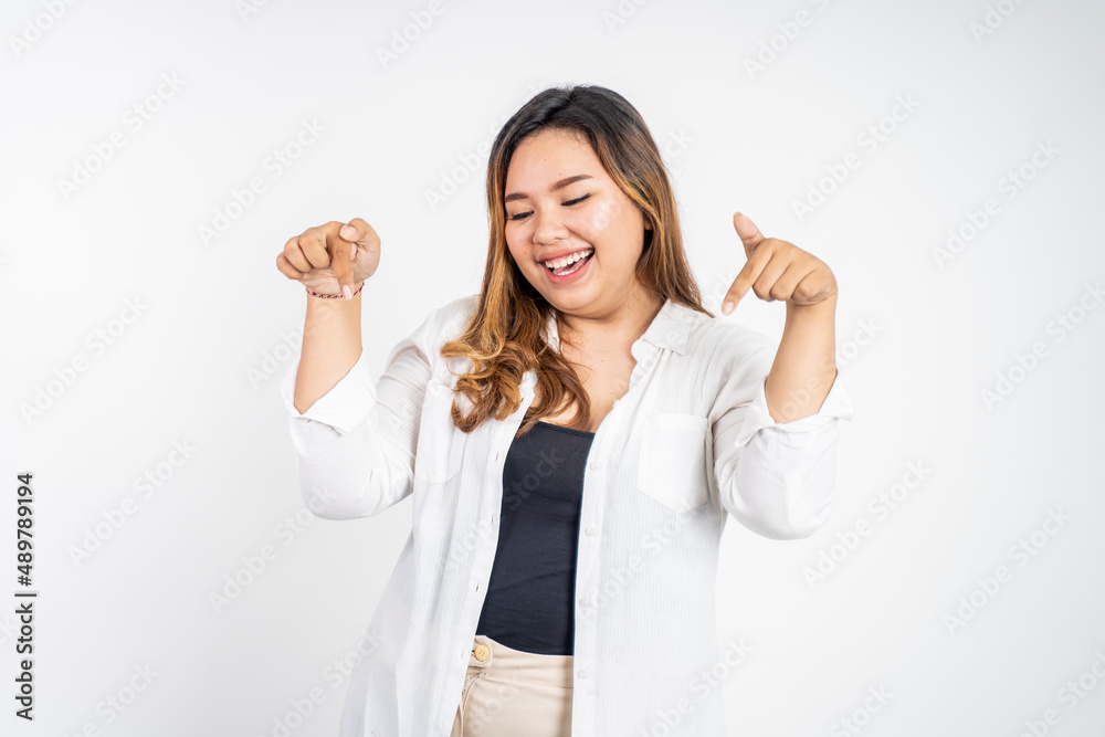 attractive asian woman with finger pointing down attractive asian woman with finger pointing down