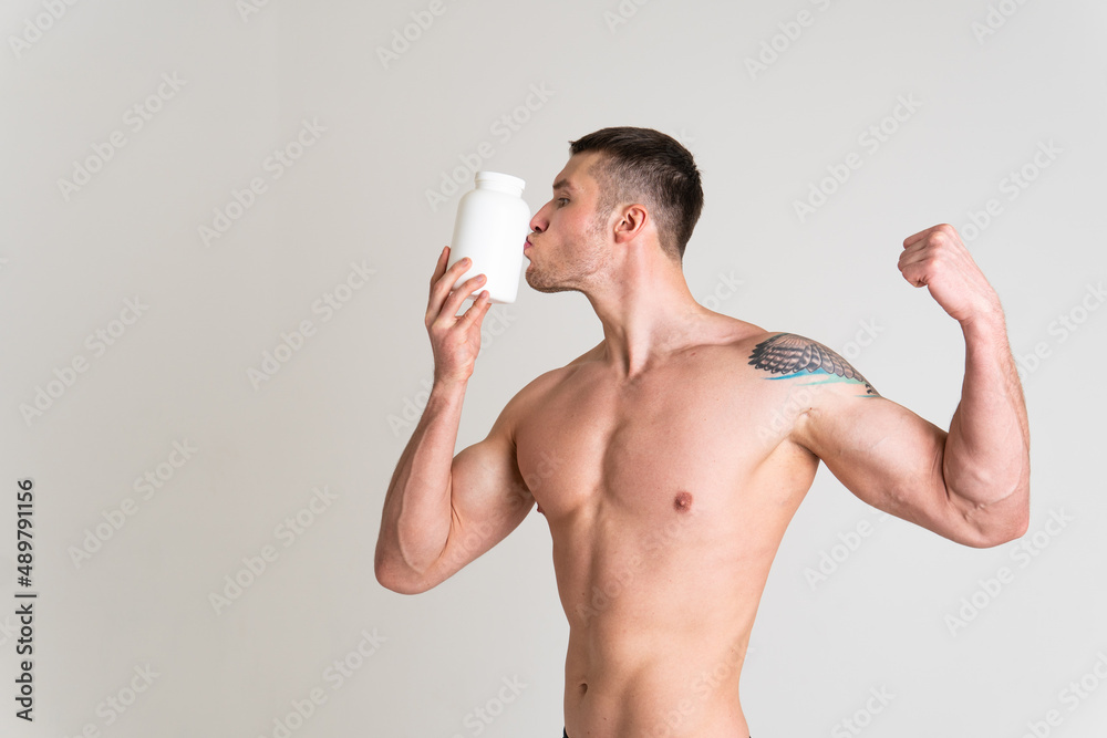 Fototapeta premium Fitness protein jars white on white background bodybuilder powder strong high ache muscle, sick white health medical, illness chronic. Hold lumbar care, back suffer attractive