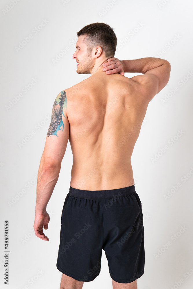 The muscles of the neck in a man on a white background are hurt pain sore person caucasian young muscular Hold sickness, ain suffer attractive