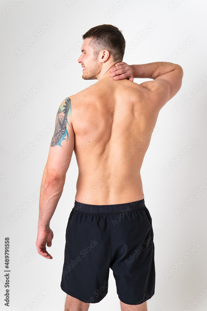Fototapeta premium The muscles of the neck in a man on a white background are hurt pain sore person caucasian young muscular Hold sickness, ain suffer attractive