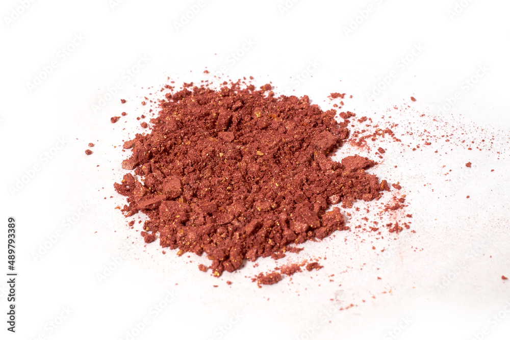 Scattered light brown eye shadow isolated on a white background Scattered light brown eye shadow isolated on a white background