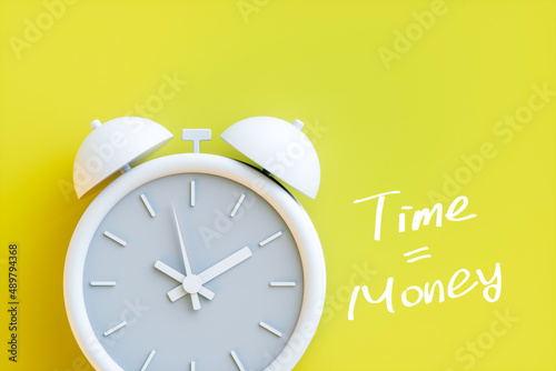 Time is money concept with alarm clock aside. 3d rendering;