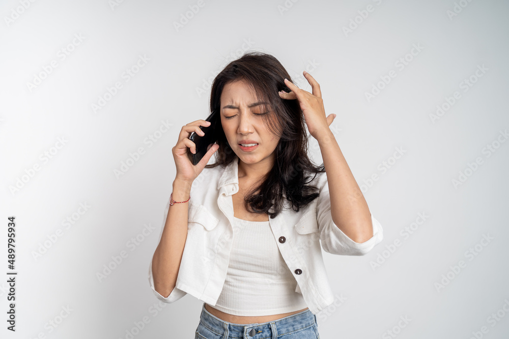 angry asian woman when making a phone call