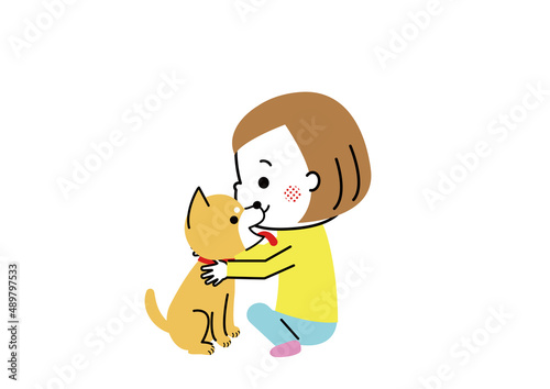 柴犬を抱きしめる女の子　顔をなめている柴犬