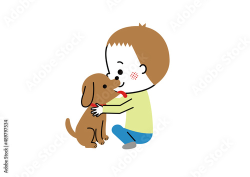 犬を抱きしめる男の子と男の子の顔をぺろぺろ舐める犬
