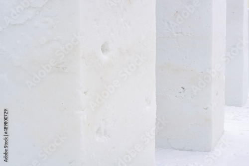 Snow texture background. Textured cold frosty surface of snow cubes