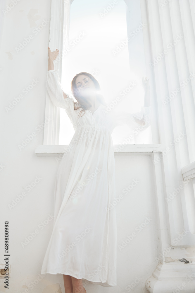 pretty woman in white dress stands near from the sun luxury pretty woman in white dress stands near from the sun luxury