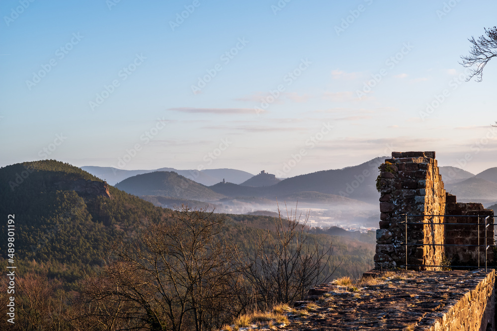 sunrise in the mountains on a castle ruin