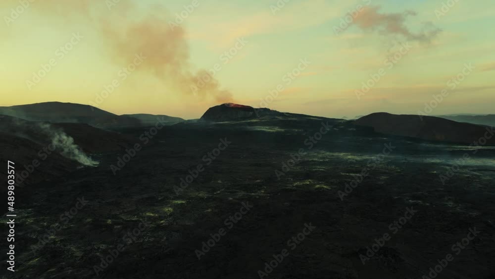 Lava Field and Volcano in Iceland at Golden Hour - Aerial Approach Lava Field and Volcano in Iceland at Golden Hour - Aerial Approach
