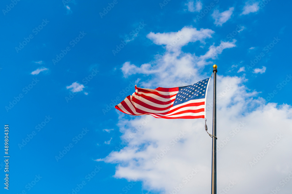 amrica flag on blue sky background.