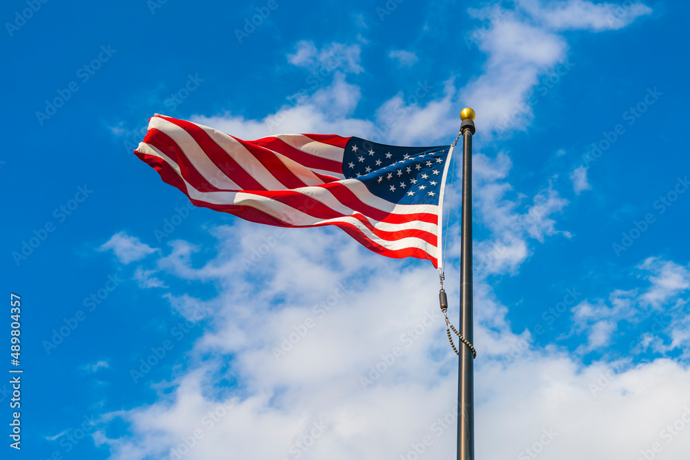 amrica flag on blue sky background. amrica flag on blue sky background.