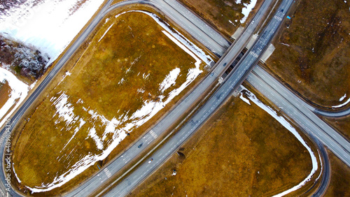 Aerial view of the highway road roundabout. Automobile asphalt circular turn © Payllik