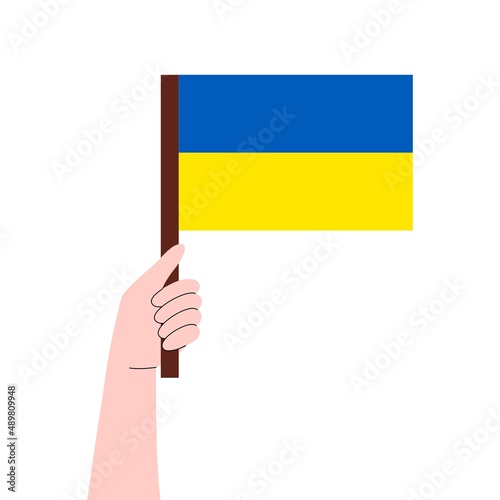 Hand holds a flag with Ukrainian. No war in Ukraine. Anti-war demonstration. Stay with Ukraine concept. Support for Ukraine.