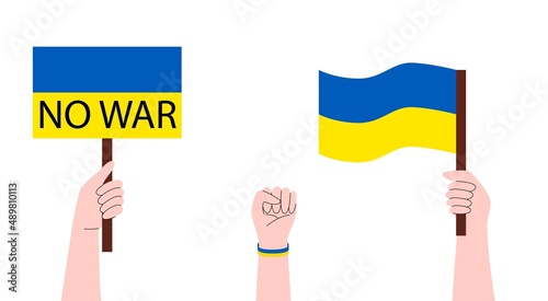 Persons holding banners, flag Ukrainian. No war in Ukraine. Anti-war demonstration. Stay with Ukraine concept. Support for Ukraine.