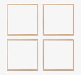 Picture frame mockup. Set of four square oak wooden frames on white wall. Templates for artwork, painting or poster