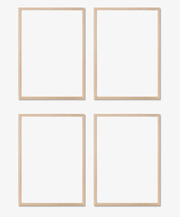 Picture frame mockup. Set of four vertical oak wooden frames on white wall. Templates for artwork, painting or poster