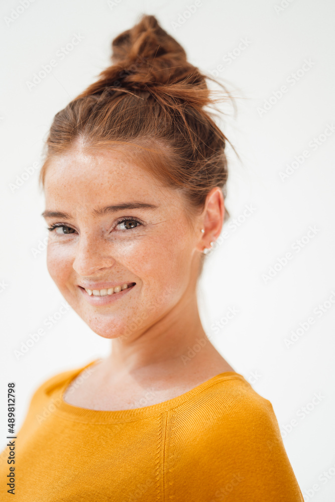 Happy woman by white background at studio Happy woman by white background at studio