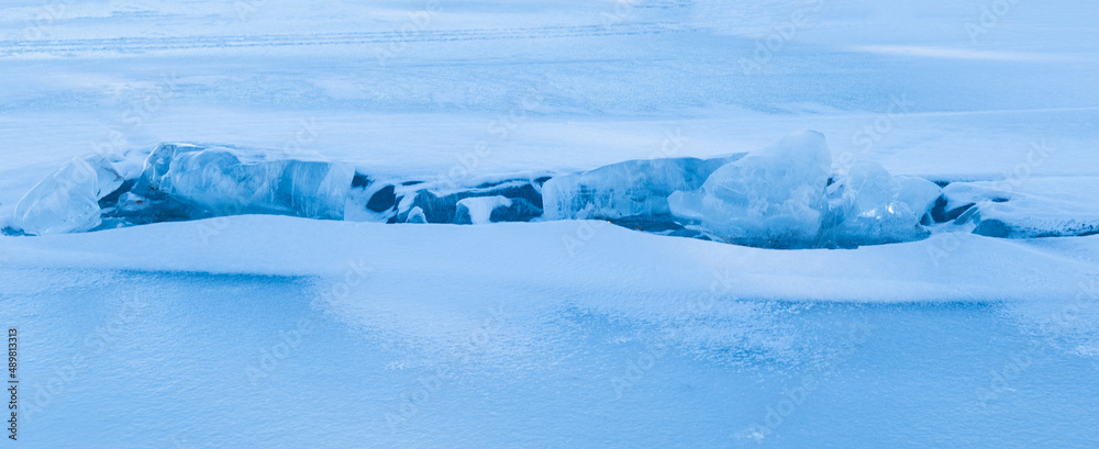 Fototapeta premium Abstract background of ice structure in a frozen lake landscape. Farnebofjarden national park in northof Sweden.