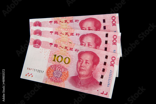 Chinese 100 RMB Yuan banknotes on black background. photo