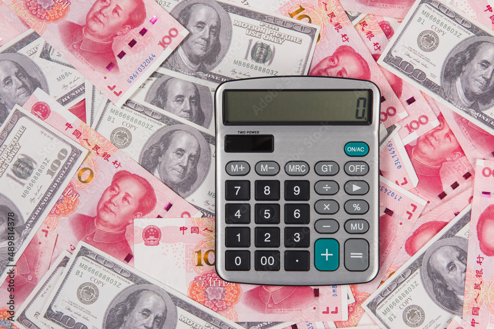 US dollar and China rmb bills with calculator US dollar and China rmb bills with calculator