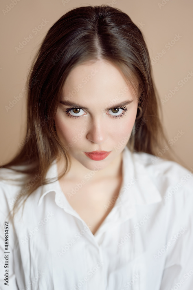 Portrait of a beautiful young woman with brown eyes. Portrait of a beautiful young woman with brown eyes.