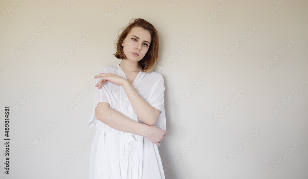 Portrait of a beautiful young woman with blue eyes. Portrait of a beautiful young woman with blue eyes.