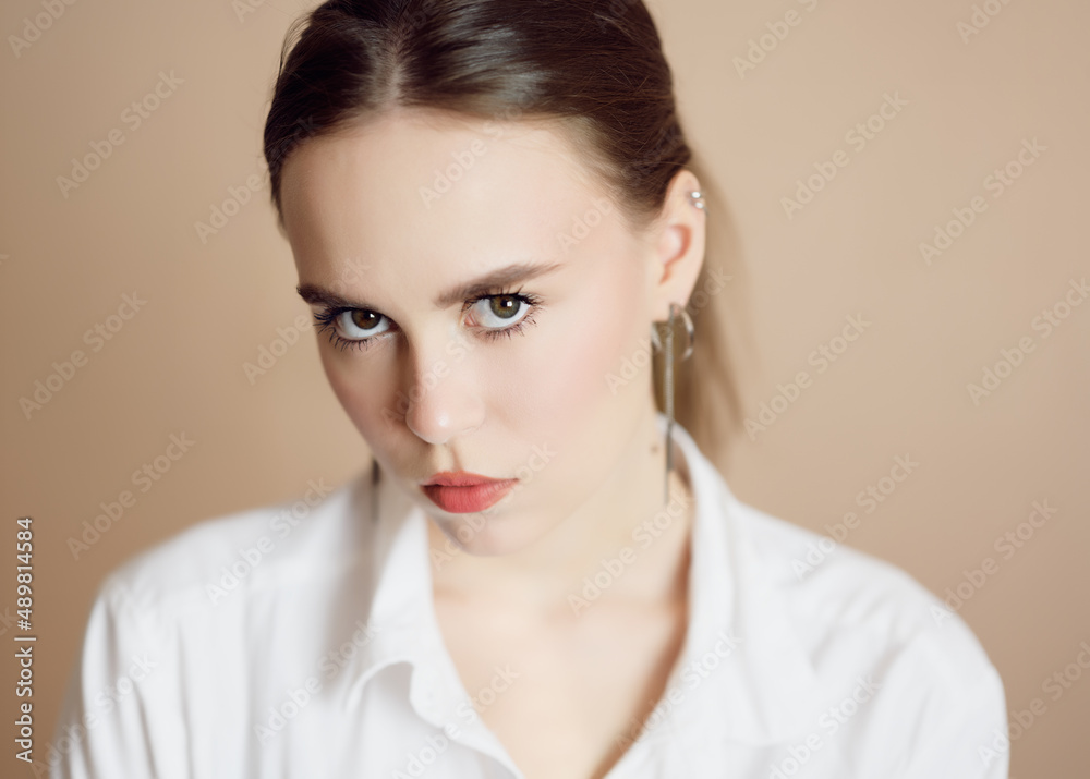 Portrait of a beautiful young woman with brown eyes. Portrait of a beautiful young woman with brown eyes.