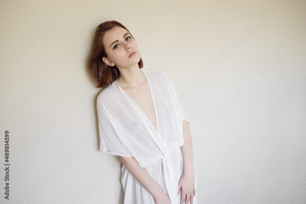 Portrait of a beautiful young woman with blue eyes. Portrait of a beautiful young woman with blue eyes.