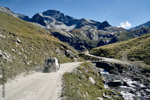 Car on gravel road at Colle Sommeiller, Turin, Italy photo
