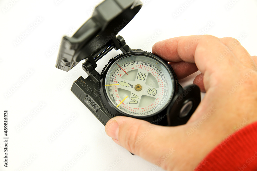 Military green compass on white background Military green compass on white background
