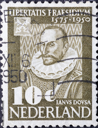 Netherlands - circa 1950 : a postage stamp from the Netherlands , showing a portrait of Janus Dousa(1545-1604), first librarian of Leiden University photo