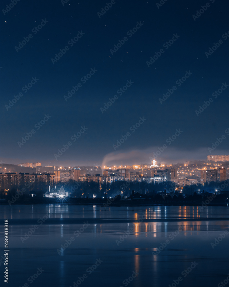 the city of Dnipro. Panoramic view of the night city from the river. Ukraine.