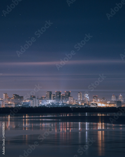 the city of Dnipro. Panoramic view of the night city from the river. Ukraine. © Denis Chubchenko