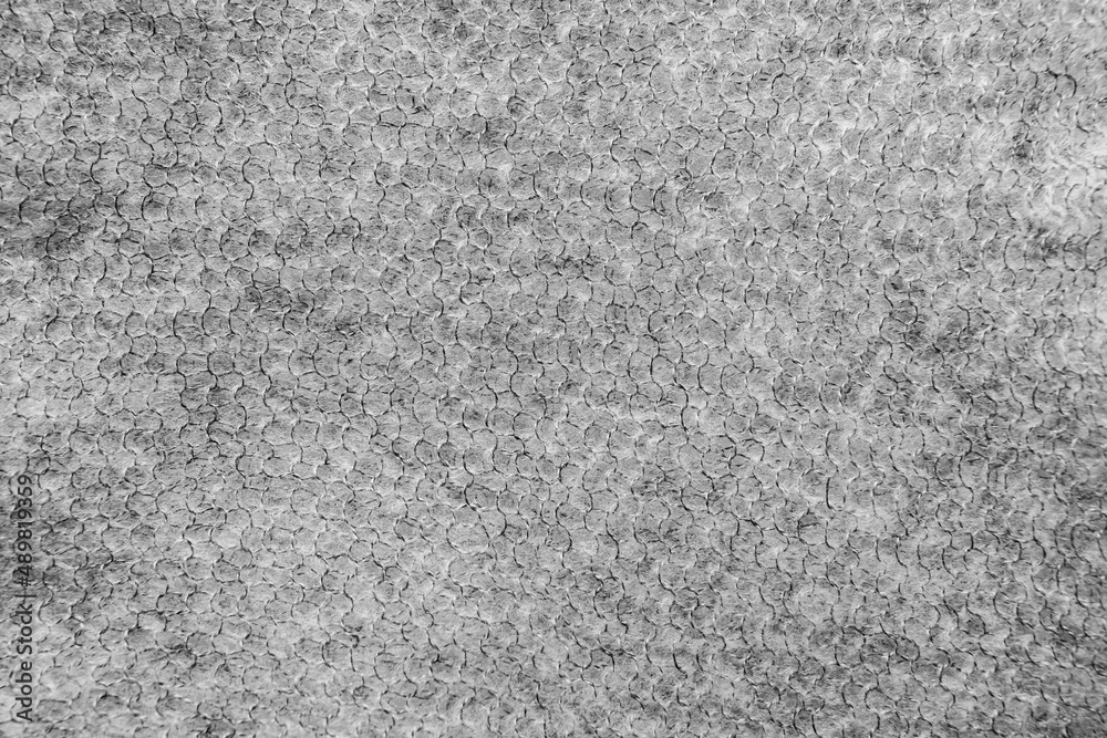 Fototapeta premium Dark gray knitted fabric openwork.